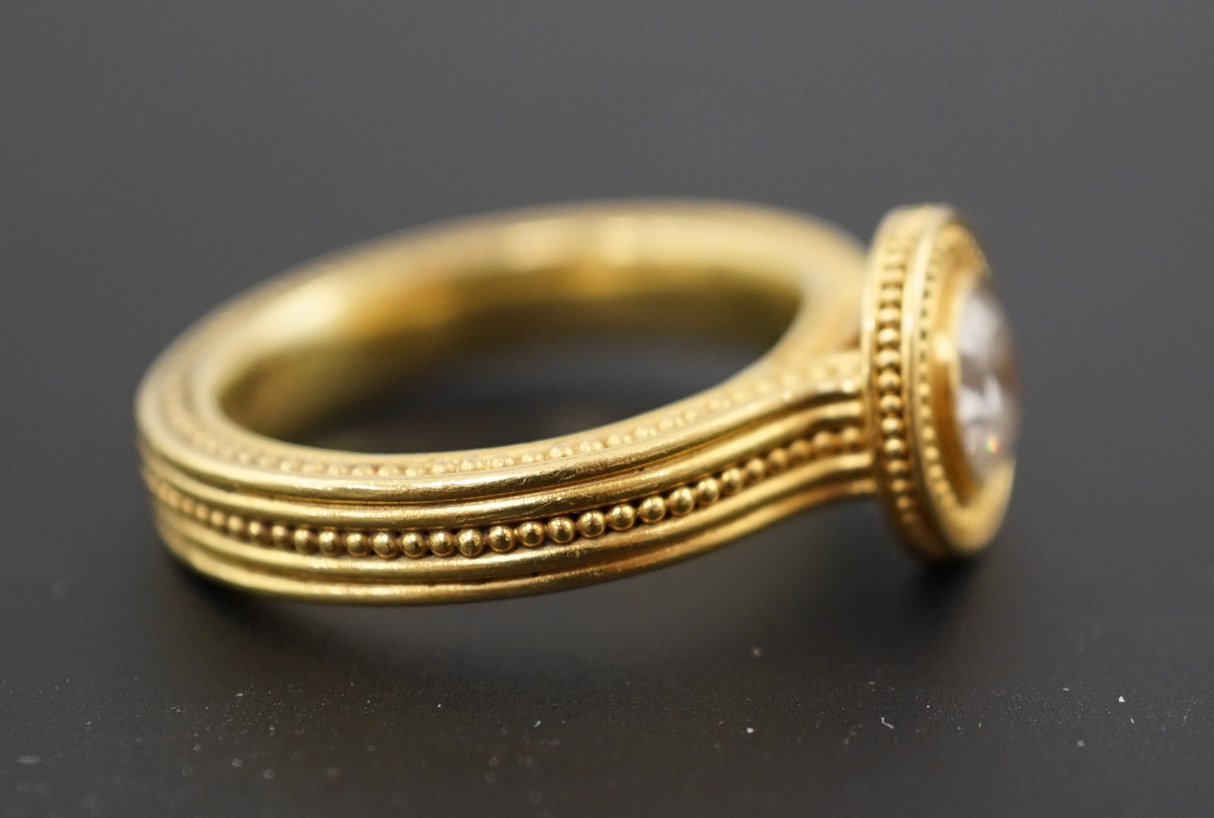 A 22k gold and collet set solitaire diamond dress ring